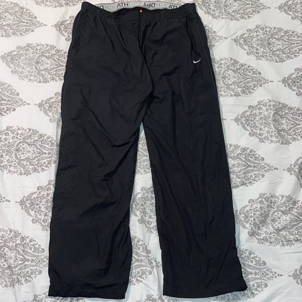 Nike dry fit wind breaker pants.